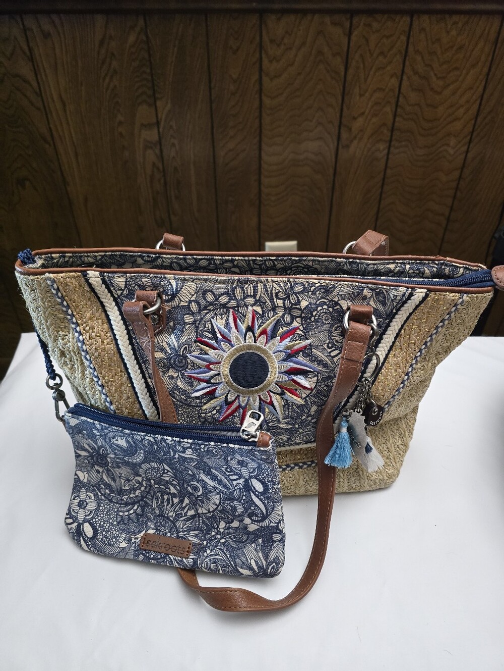 Sakroots Boho Straw Tote Bag with Blue Floral Accent and Leather Straps